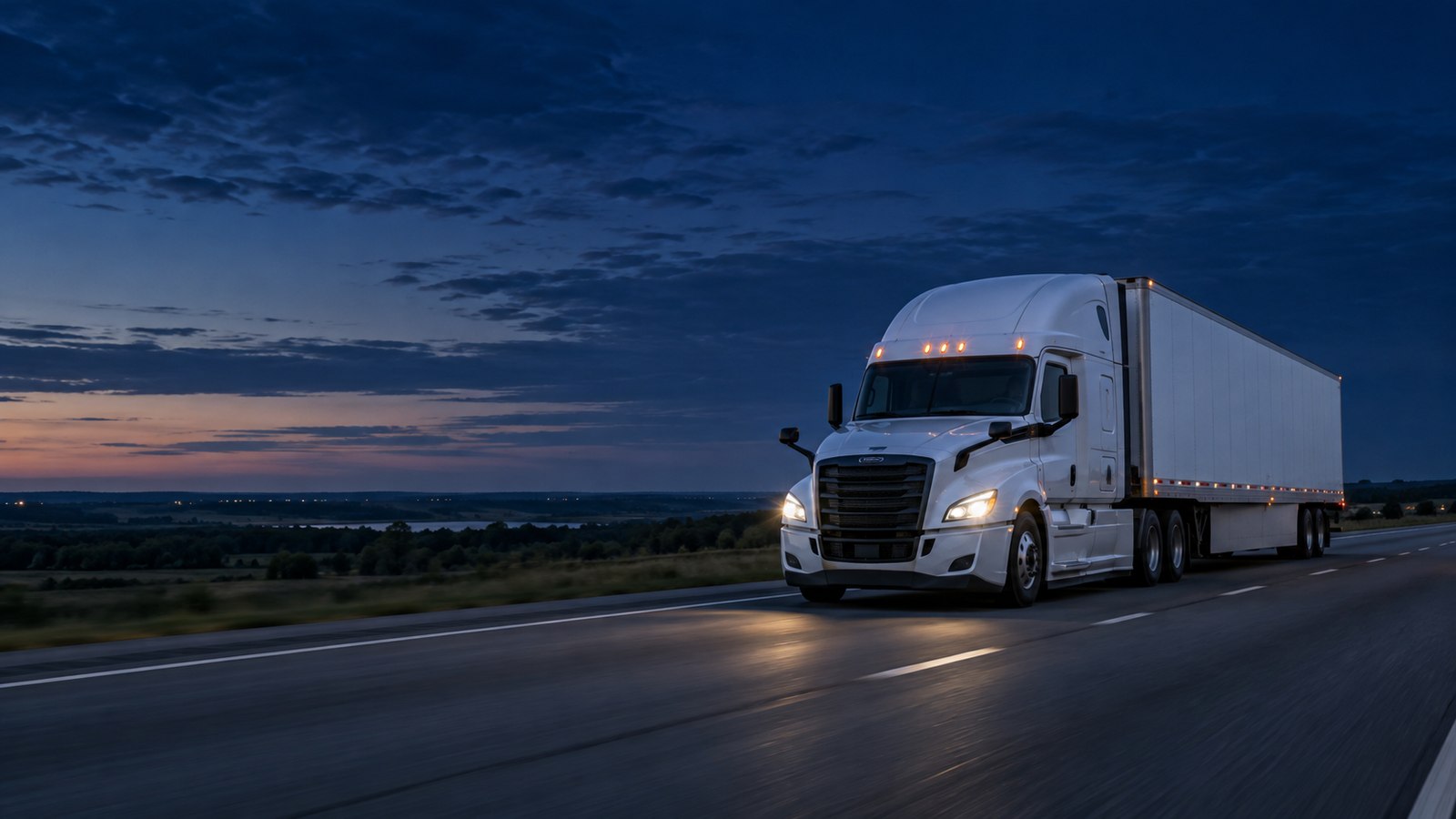 Illustrative highway scene at dusk with a tractor-trailer.